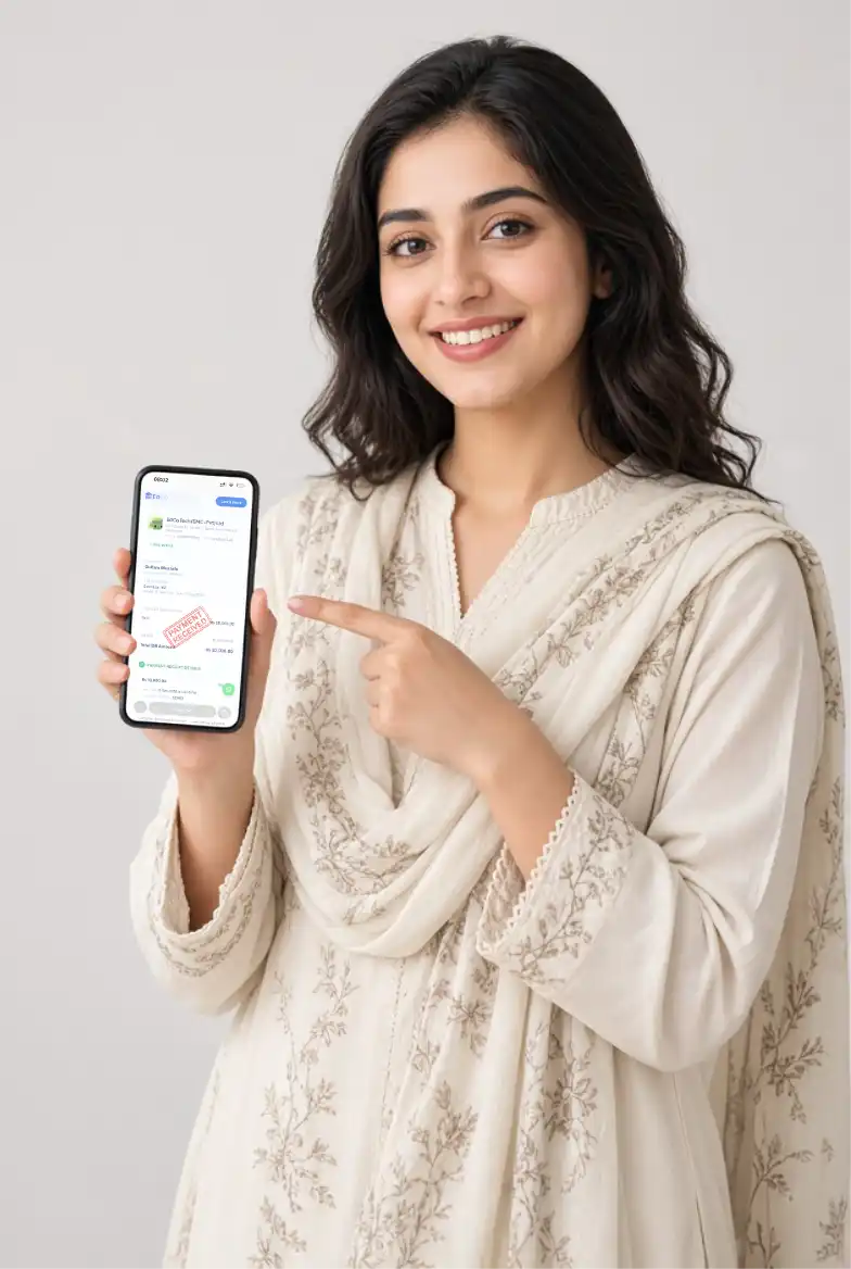 A school administrator smiling and pointing to EdCo's fee collection dashboard on her phone